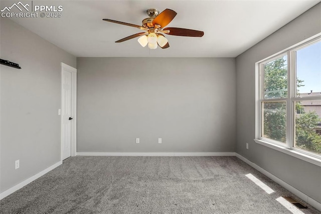 carpeted empty room with ceiling fan