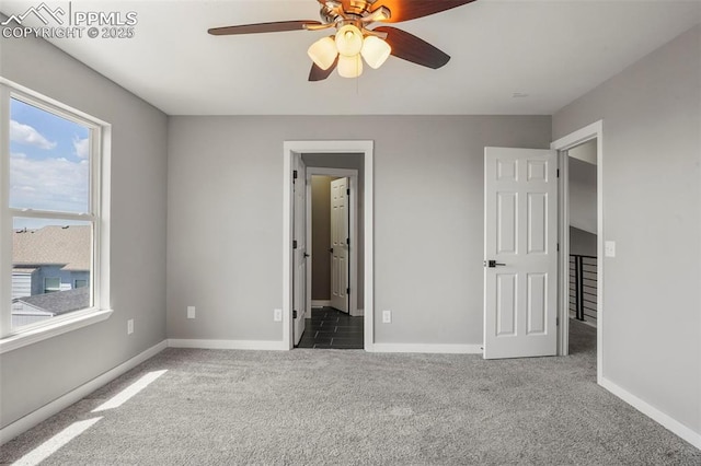 unfurnished bedroom with carpet flooring and ceiling fan