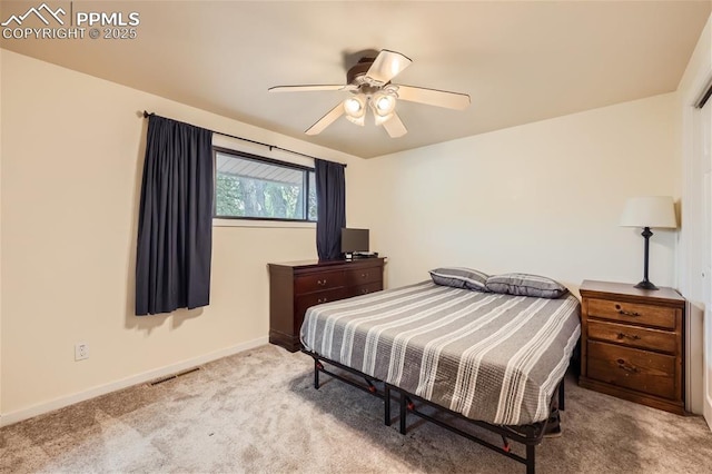 bedroom featuring light carpet and ceiling fan