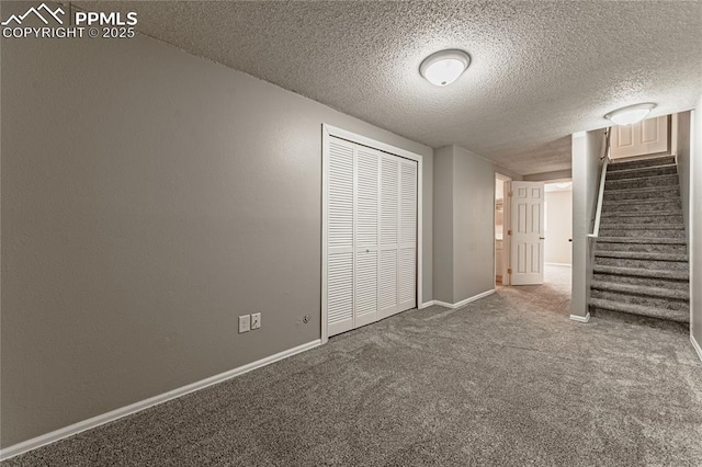 unfurnished bedroom featuring a closet, carpet, and a textured ceiling