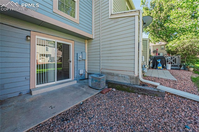 exterior space featuring a patio and cooling unit