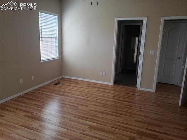 empty room featuring light hardwood / wood-style floors