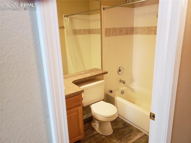 full bathroom featuring bathing tub / shower combination, vanity, and toilet