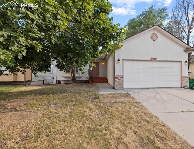 view of front facade with a garage and a front lawn