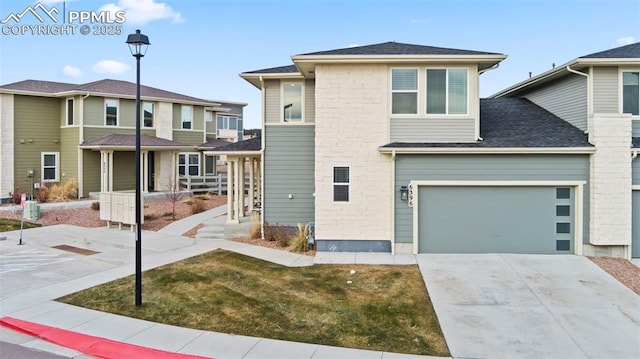 view of front of house with a garage and a front lawn