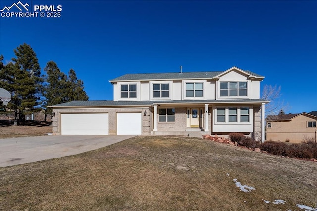 view of front of house featuring a front yard and a garage