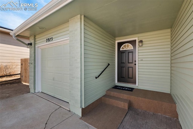 entrance to property featuring a garage