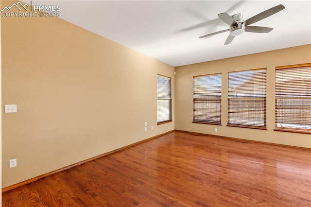 spare room featuring ceiling fan and wood-type flooring