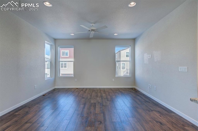 unfurnished room with a textured ceiling, ceiling fan, and dark hardwood / wood-style floors