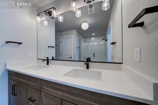 bathroom featuring vanity and a shower with shower door