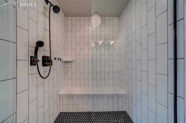 bathroom featuring a tile shower