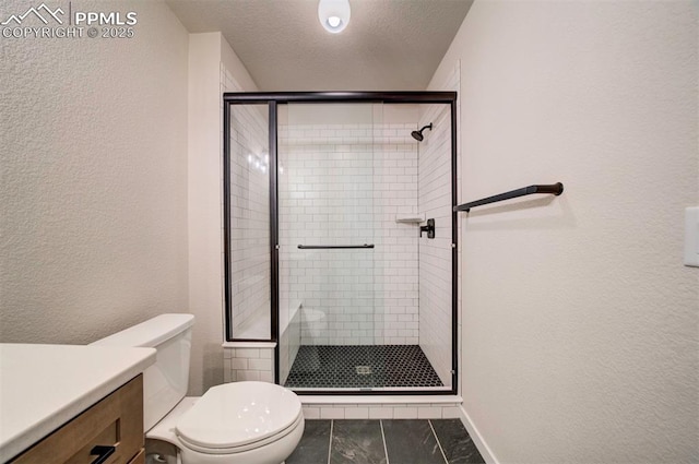 bathroom with tile patterned floors, a textured ceiling, toilet, and a shower with door