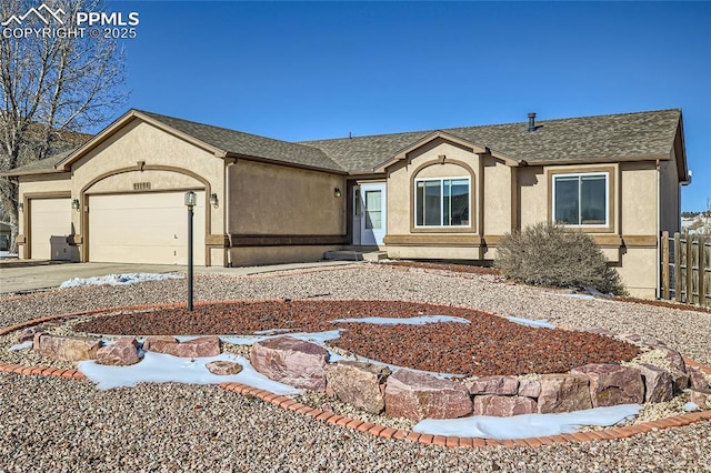 ranch-style home featuring a garage