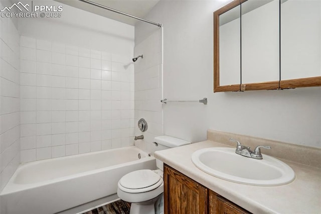 full bathroom with wood-type flooring, vanity, toilet, and tiled shower / bath