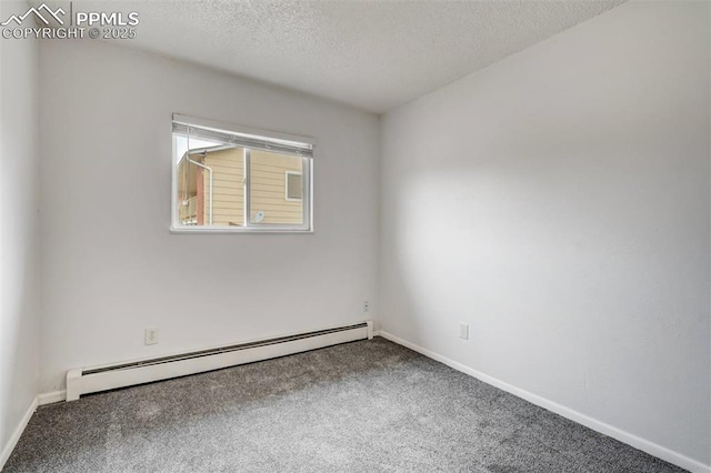 empty room featuring carpet, a textured ceiling, and a baseboard heating unit