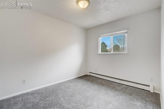 carpeted spare room with a textured ceiling and a baseboard radiator