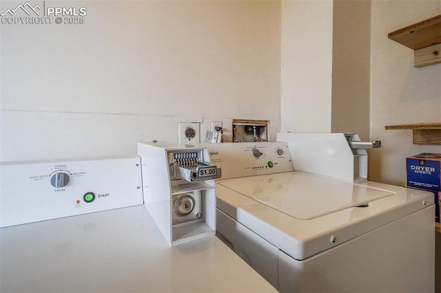 clothes washing area with washer and dryer