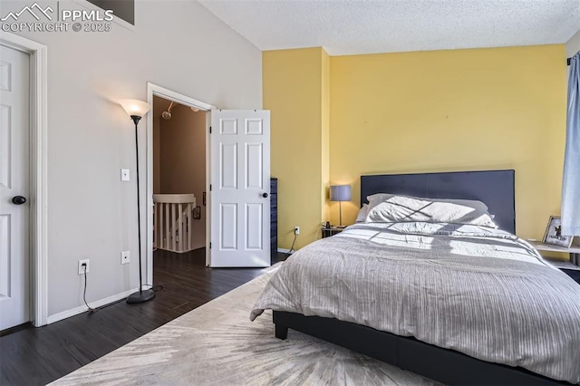 bedroom featuring dark hardwood / wood-style flooring