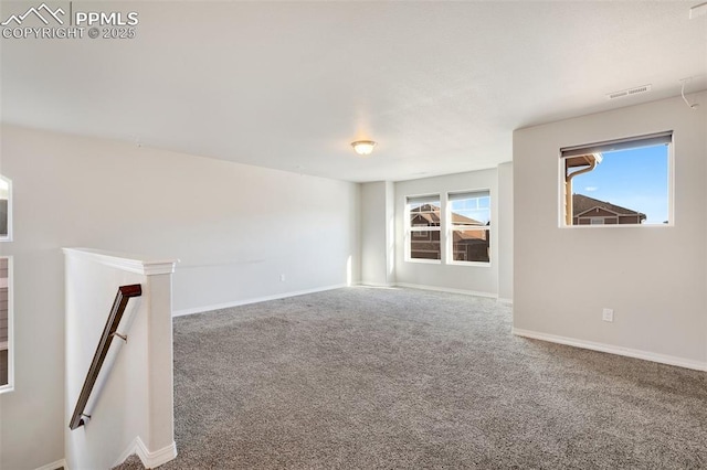 empty room featuring carpet floors