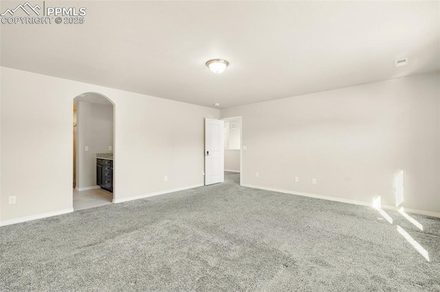 spare room with light carpet