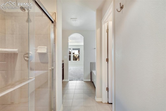 hallway with light tile patterned floors