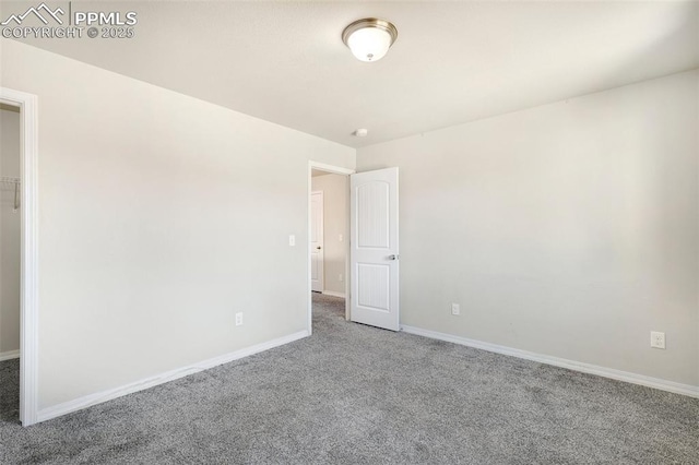 unfurnished room with carpet flooring