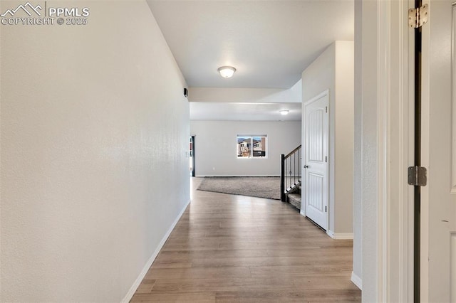 corridor featuring light hardwood / wood-style flooring