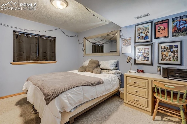 carpeted bedroom with a textured ceiling