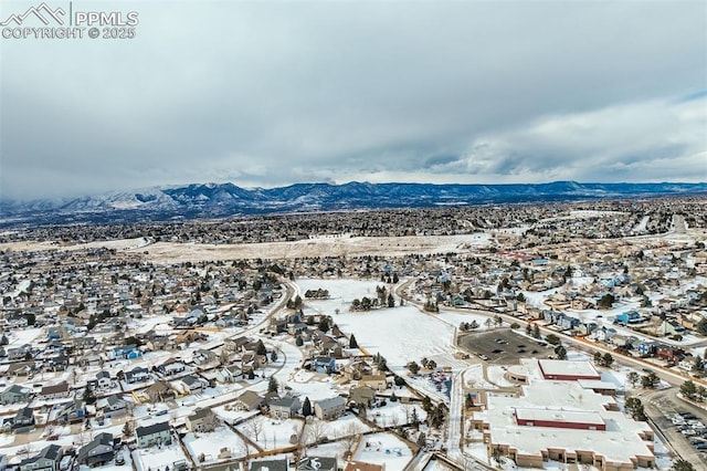 birds eye view of property with a mountain view