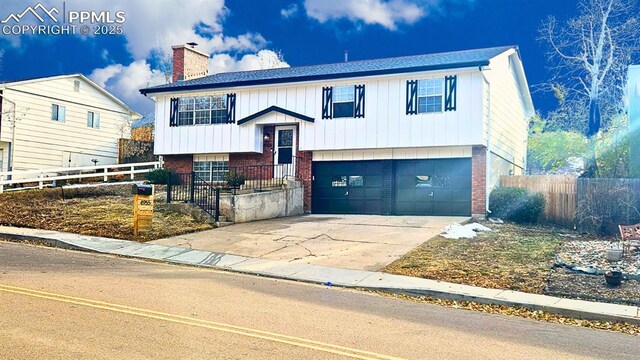 split foyer home featuring a garage