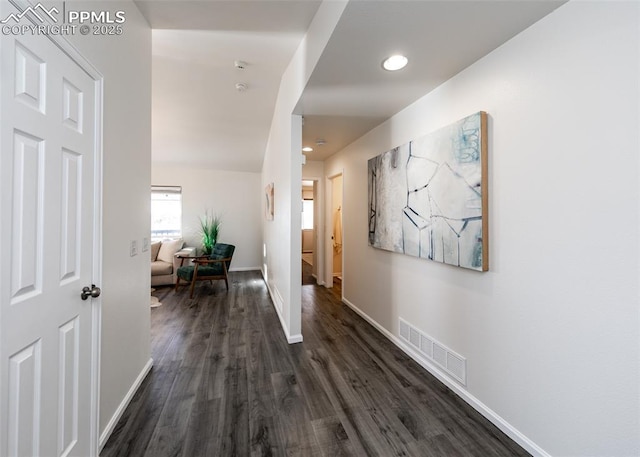 hall with dark hardwood / wood-style floors