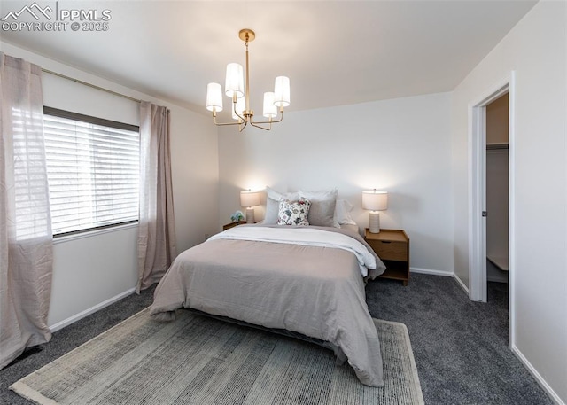 bedroom with dark carpet and an inviting chandelier