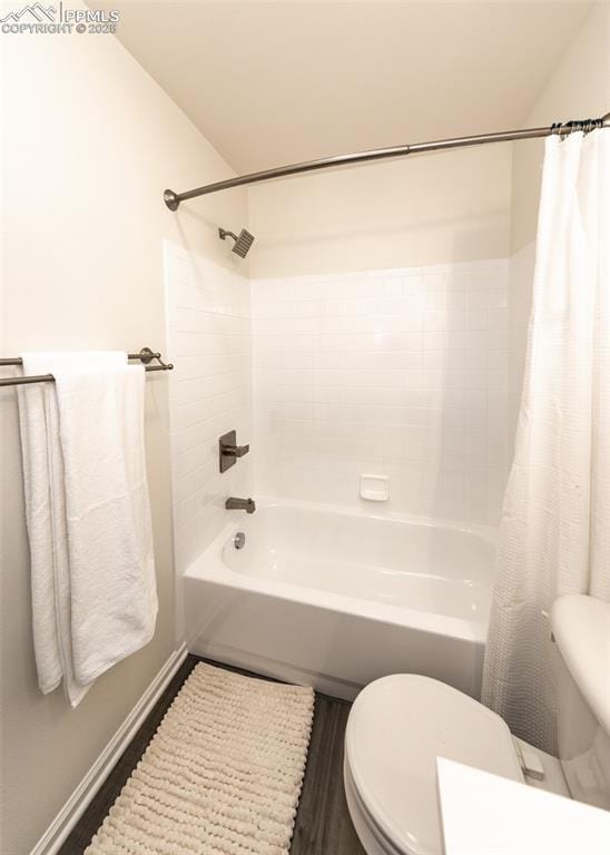 bathroom with wood-type flooring, toilet, and shower / tub combo with curtain