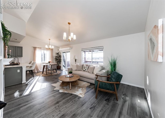 living room with a chandelier, a healthy amount of sunlight, vaulted ceiling, and dark wood-type flooring