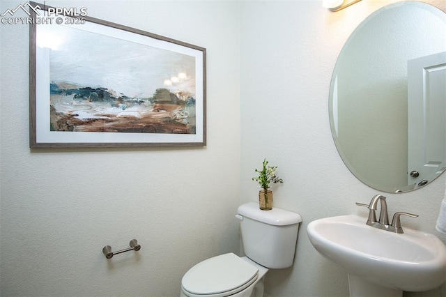 bathroom with toilet and sink