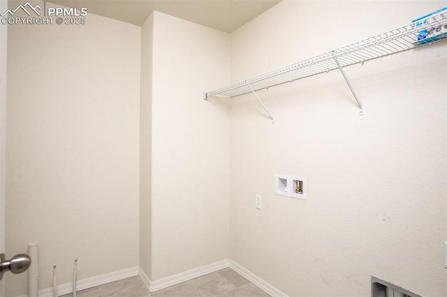 laundry room with light tile patterned flooring and washer hookup