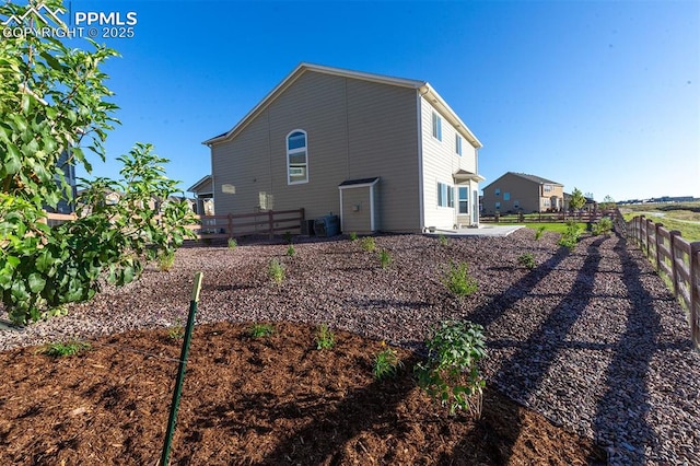 view of side of home with central AC unit