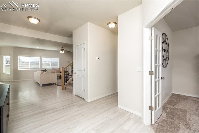 hall with light hardwood / wood-style flooring