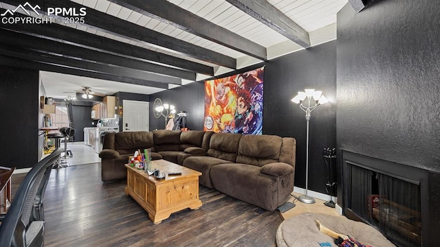 living room featuring beam ceiling, ceiling fan, and dark hardwood / wood-style floors