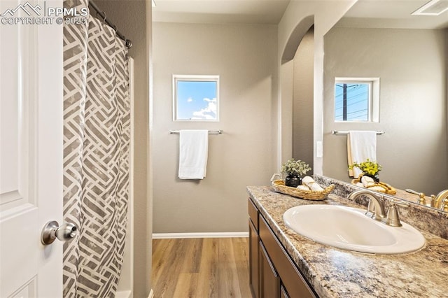 bathroom featuring vanity and hardwood / wood-style floors