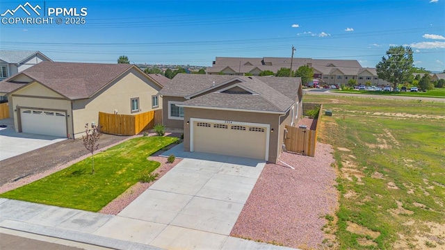 ranch-style house with a garage and a front yard