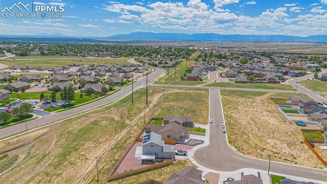 drone / aerial view featuring a mountain view