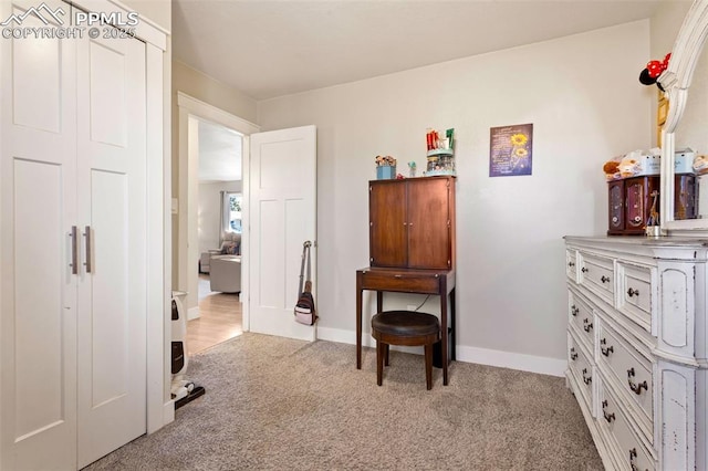 miscellaneous room with light colored carpet