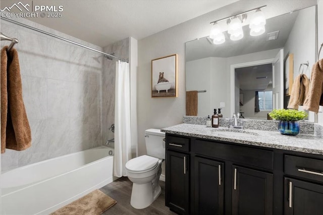 full bathroom with shower / bath combination with curtain, toilet, vanity, and hardwood / wood-style flooring