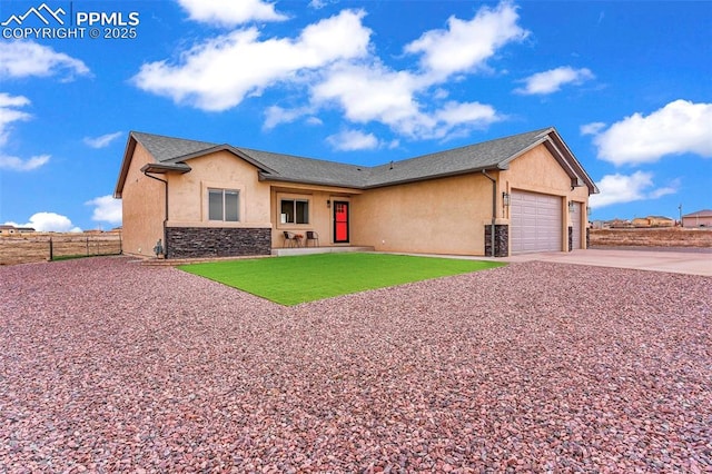 ranch-style home with a front lawn and a garage