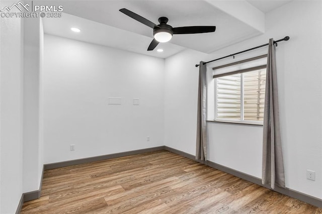 spare room featuring ceiling fan and light hardwood / wood-style flooring