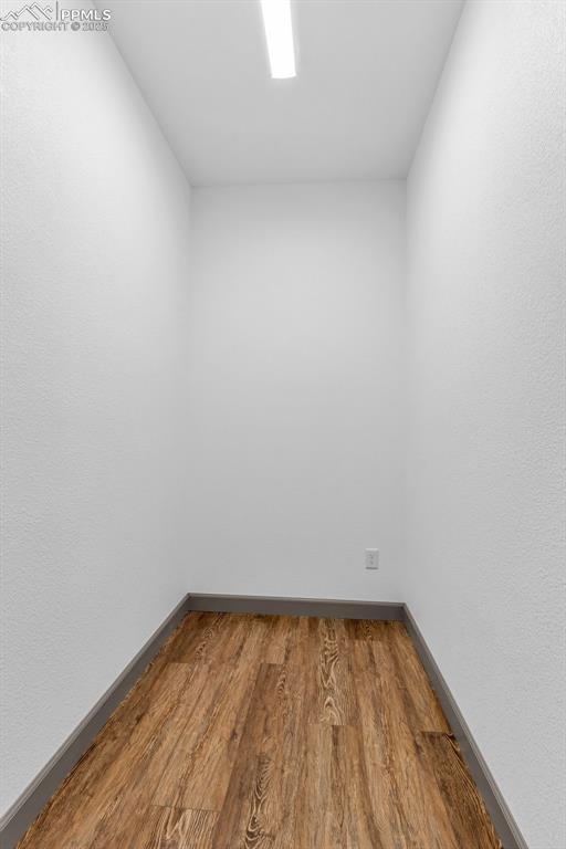 unfurnished room featuring hardwood / wood-style floors