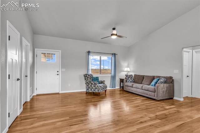 living room featuring ceiling fan and light wood-type flooring