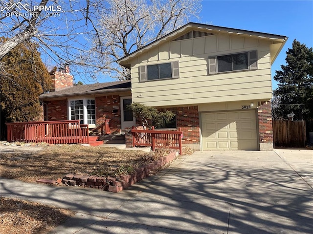 view of front of house featuring a garage and a wooden deck