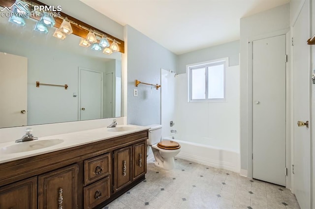 full bathroom featuring vanity, tub / shower combination, and toilet